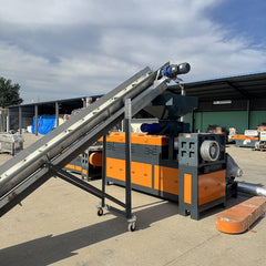 Pulverized material granulator with single screw feeder