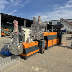 Pulverized material granulator with single screw feeder