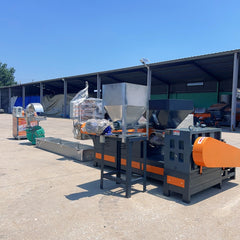 Pulverized material granulator with single screw feeder