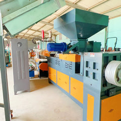 Pulverized material granulator with single screw feeder