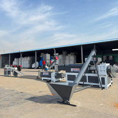 Pulverized material granulator with single screw feeder